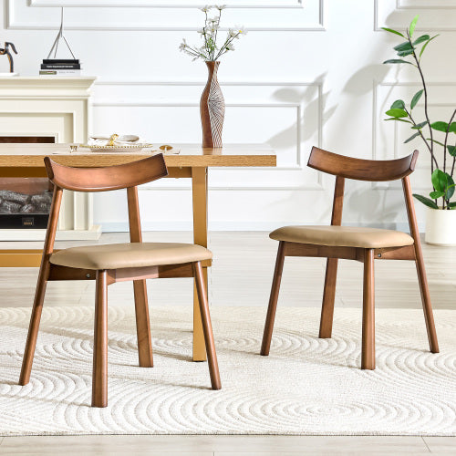 2 walnut colored solid wood dining chairs, with khaki PU soft cushions and curved backrests that fit the curves of the back, suitable for home dining.