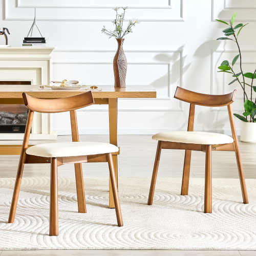 2 walnut colored solid wood dining chairs, with khaki PU soft cushions and curved backrests that fit the curves of the back, suitable for home dining.